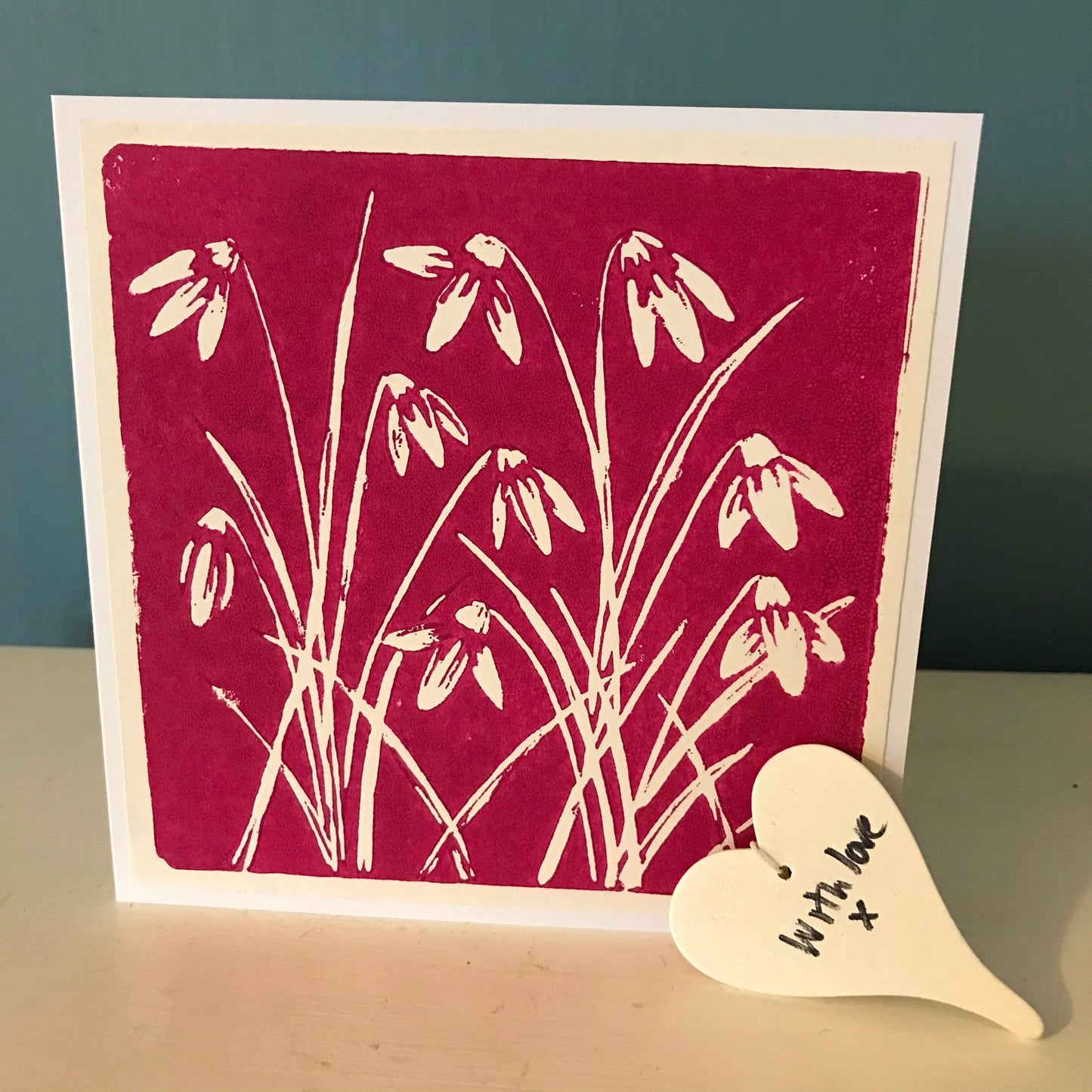 A beautiful handprinted linocut of Snowdrops, in cyan blue or magenta. A handmade greetings card for any occasion, left blank inside for your own message.