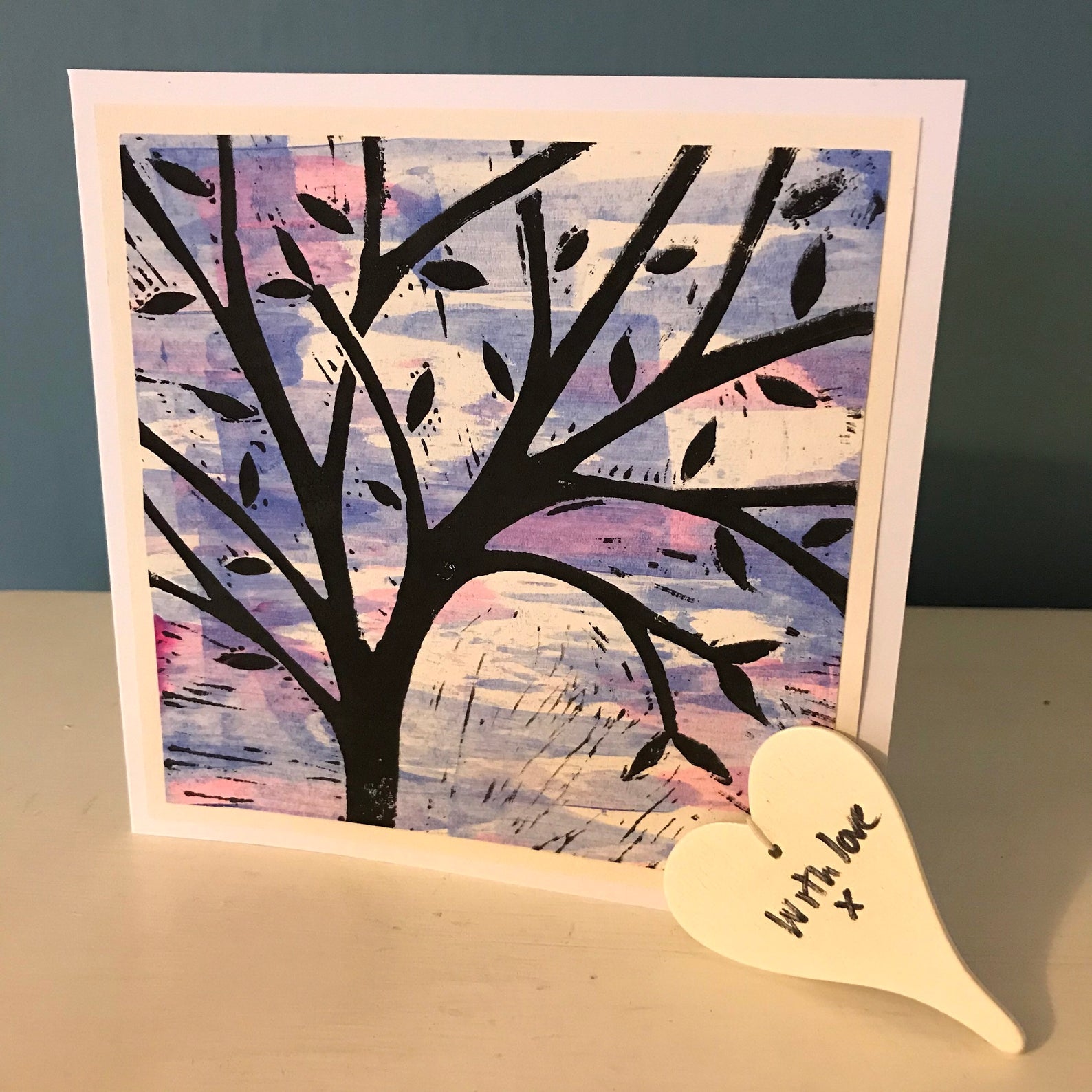 A tree with a blue/pink sky.  This lino cut is handprinted.  Blank inside for any occasion.