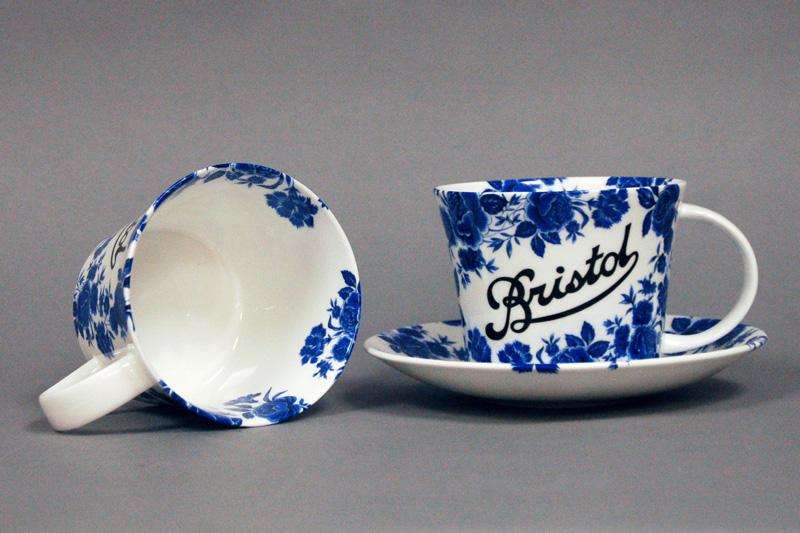 Stokes Croft China Breakfast cup and saucer, with the blue rose and the classic Bristol scroll. Individually deorated in Bristol.