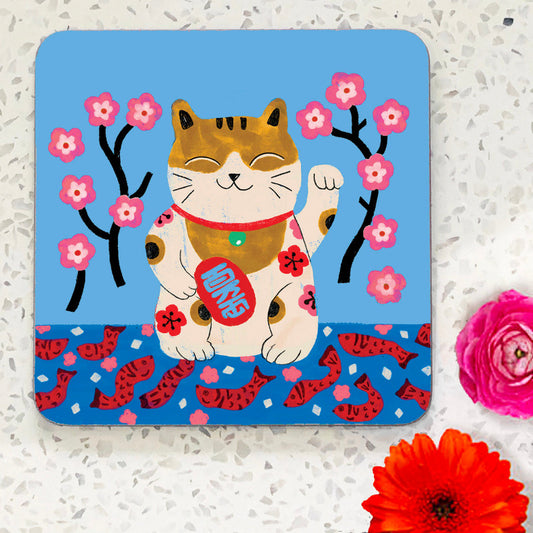 Coaster with smiling cat illustation on blue background