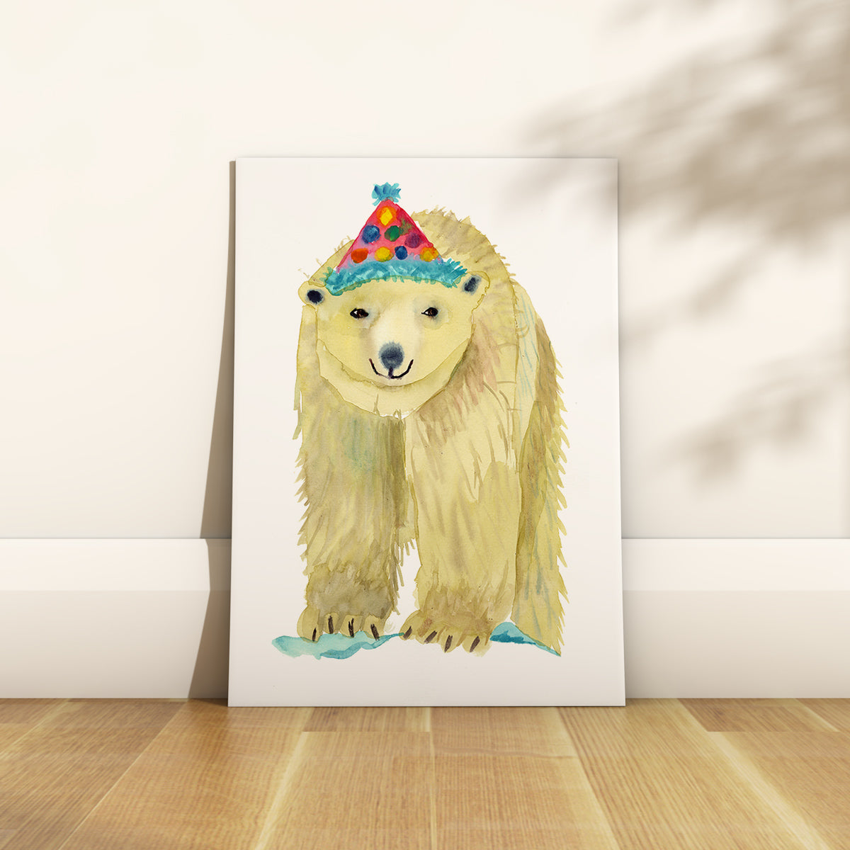 Rosie Webb a bristol based water colour illustrator. A happy polar bear in a party hat.  Edit alt text
